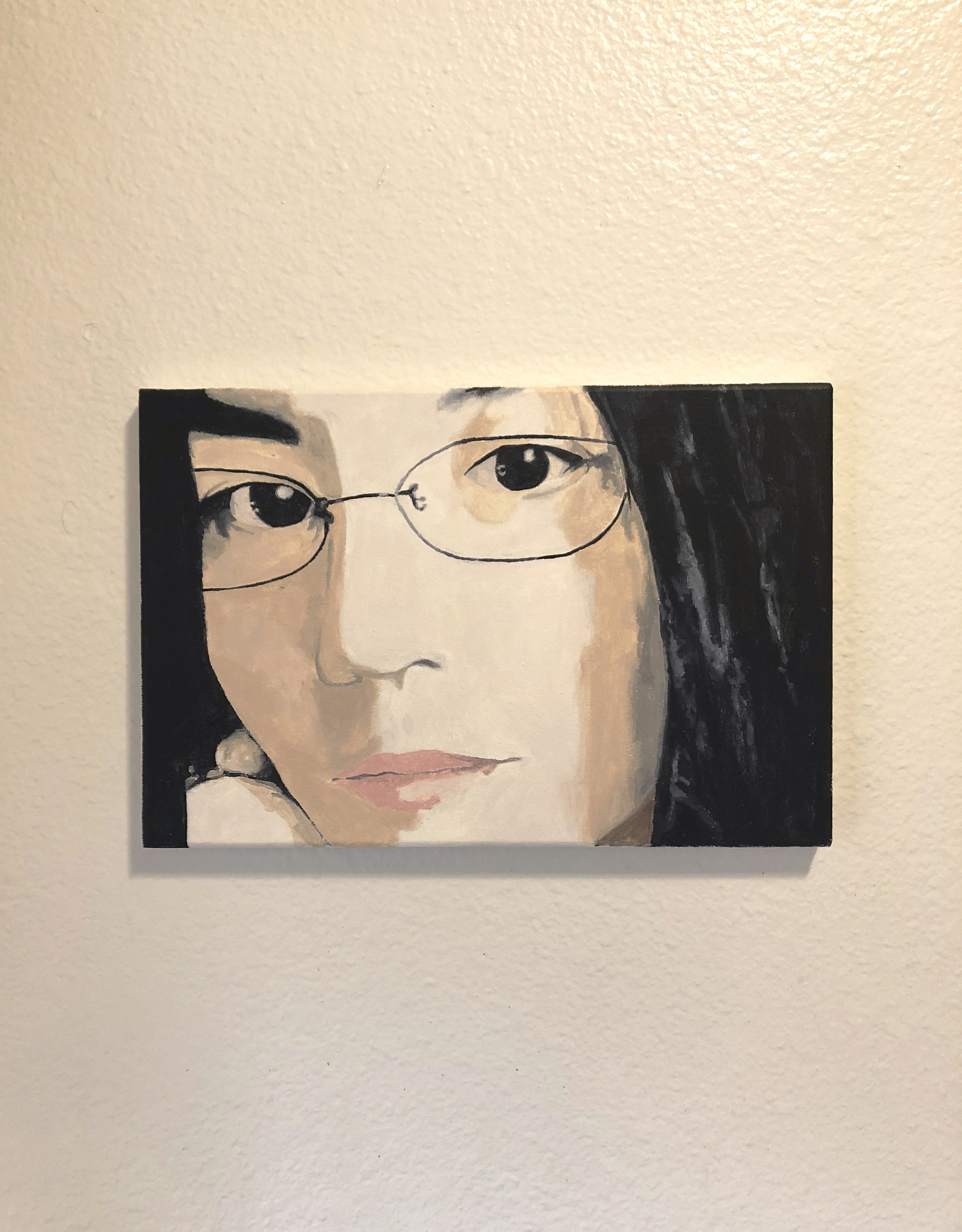Close up acryllic painting of Maye Wong on a white wall